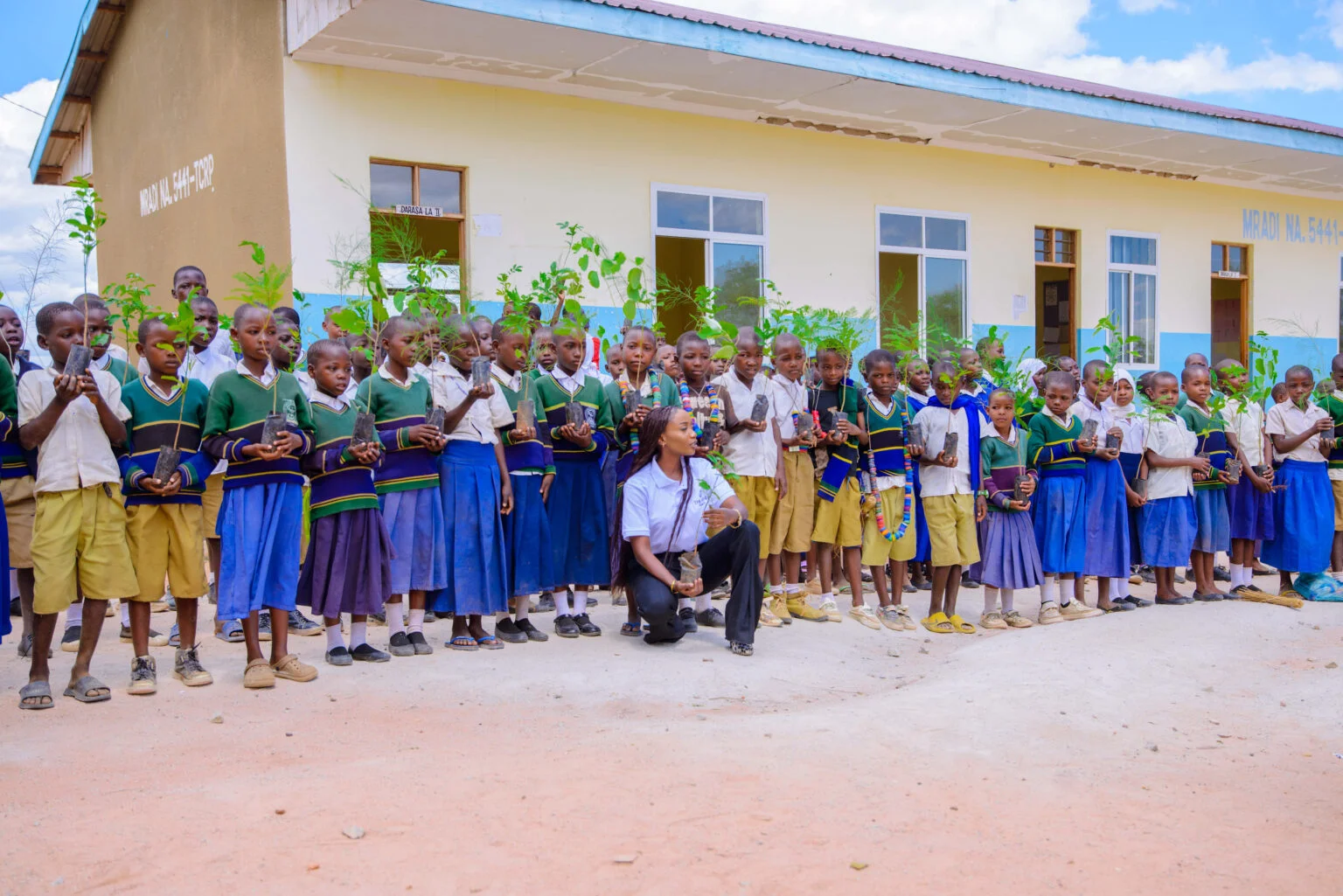 FRIDA AMANI COLLABORATED WITH CHILDREN TO PLANT TREES AT MPAMANTWA PRIMARY SCHOOL.