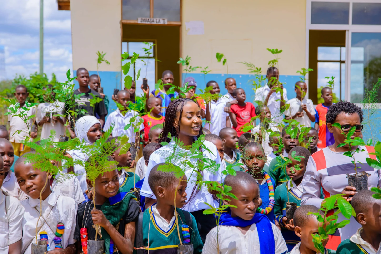 FRIDA AMANI COLLABORATED WITH CHILDREN TO PLANT TREES AT MPAMANTWA PRIMARY SCHOOL.
