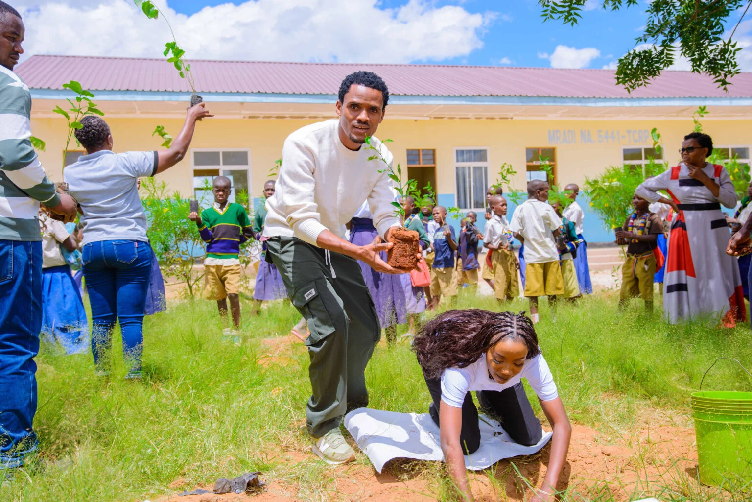 FRIDA AMANI COLLABORATED WITH CHILDREN TO PLANT TREES AT MPAMANTWA PRIMARY SCHOOL.